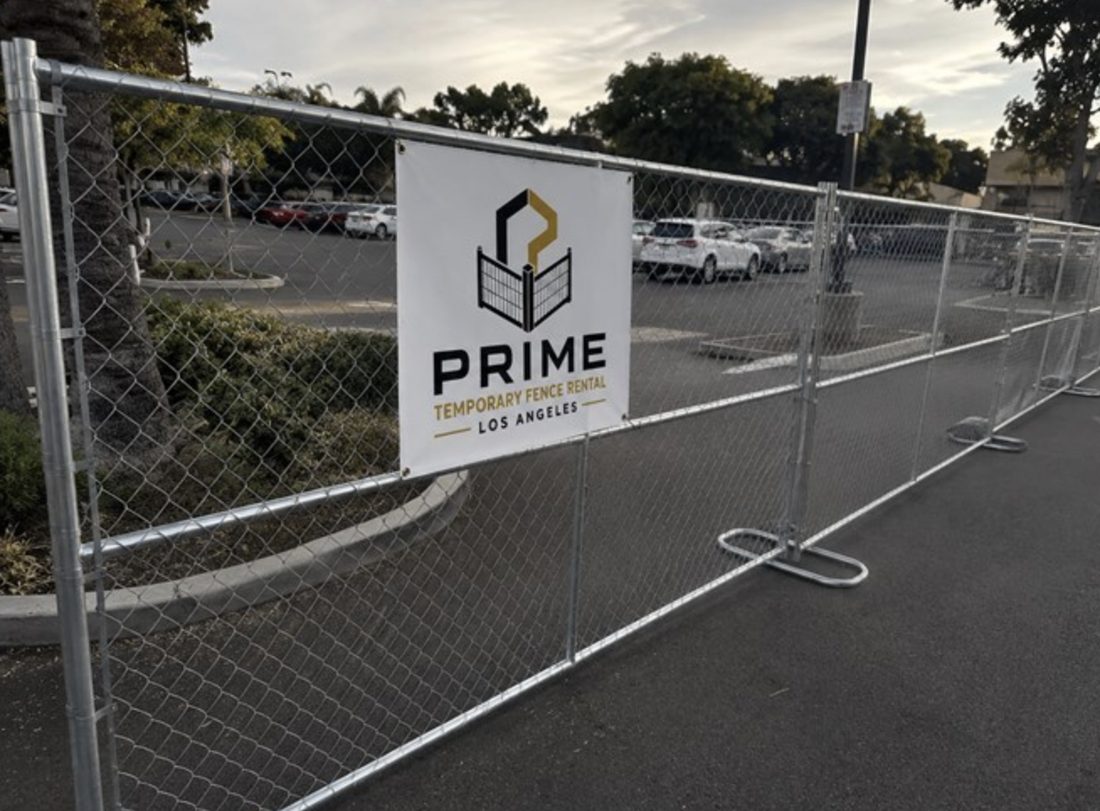 Temporary fence securing a commercial parking lot