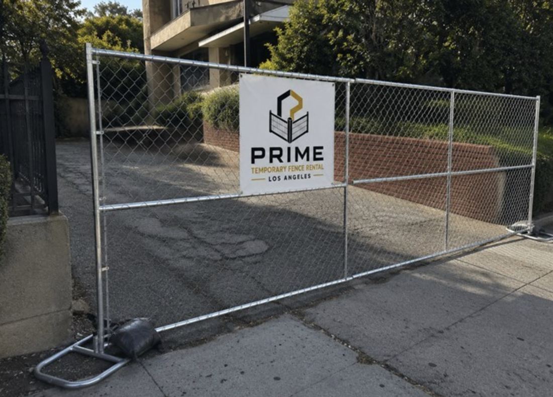 Temporary fence panel across a residential driveway